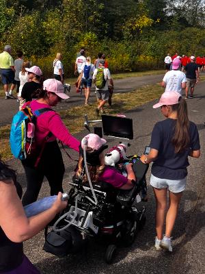 Patricia at the 2024 Walk ALS with daughter, Laura, granddogger, Cleo, and bff/caregiver, Anna.